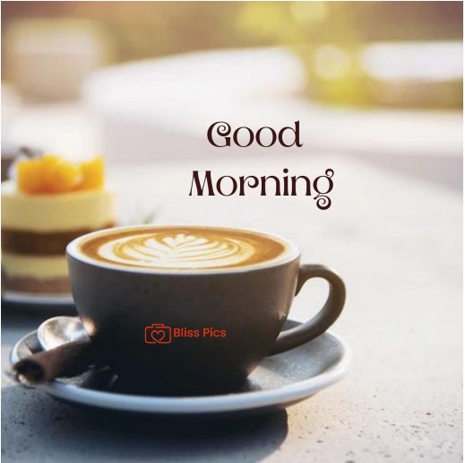 cappuccino in black cup and saucer with cake in background in morning cappuccino in black cup and saucer with cake in background in morning - good morning images with coffee